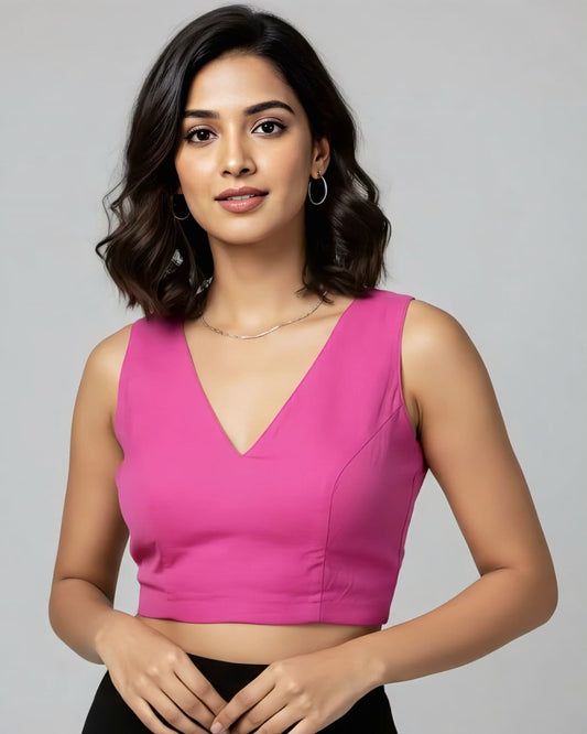 Hot pink sleeveless fancy blouse design with V neckline in cotton fabric for festive and party wear sarees.