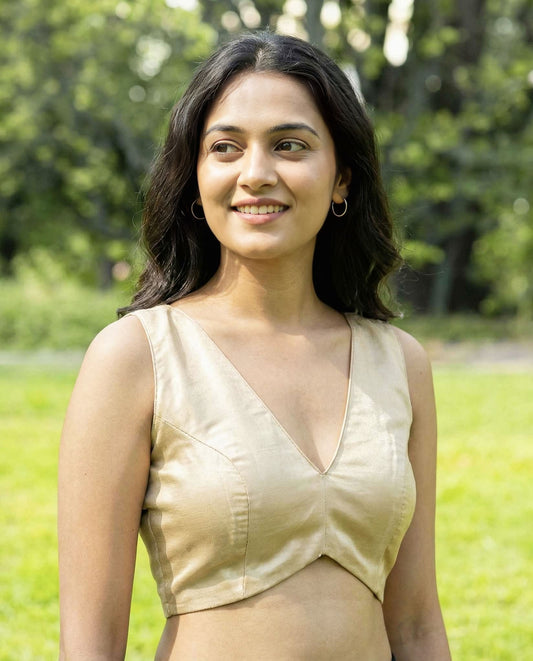 Elegant Beige V-Neck Fancy Blouse Design – Sleeveless Saree Blouse for Modern Look