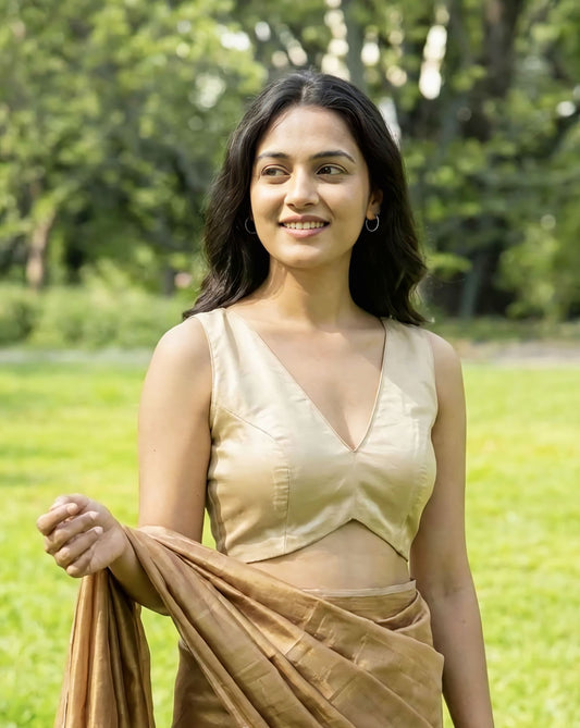 Beige sleeveless deep V-neck fancy blouse design with saree