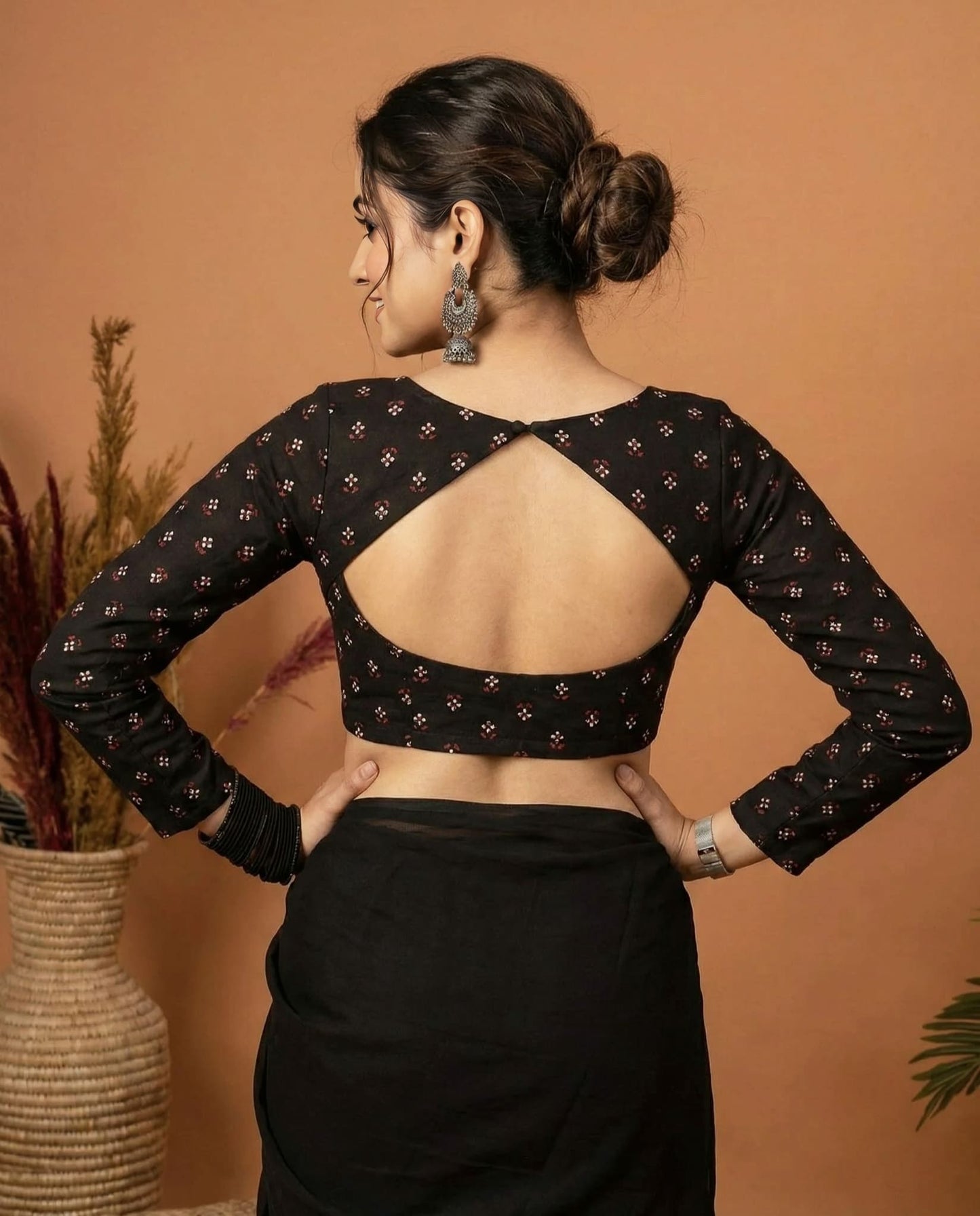 Elegant Black Sweetheart Neck Blouse with Floral Print