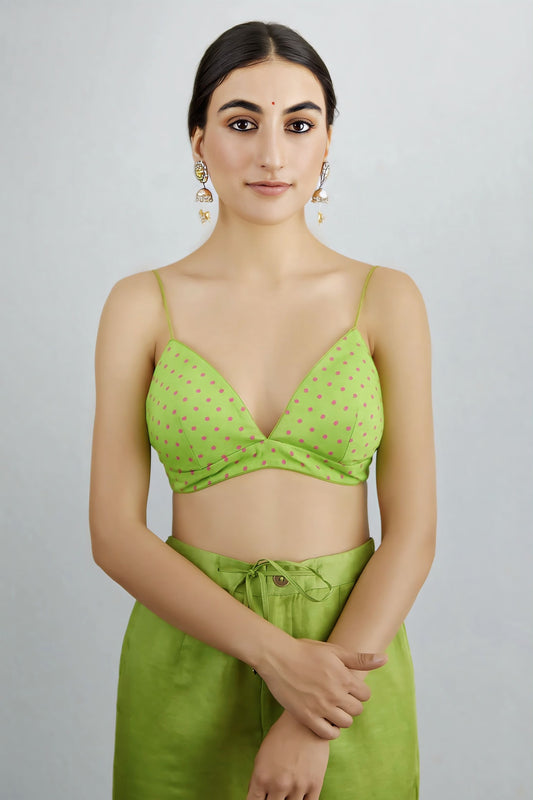 Lime green polka dot fancy blouse design with deep V neck and spaghetti straps