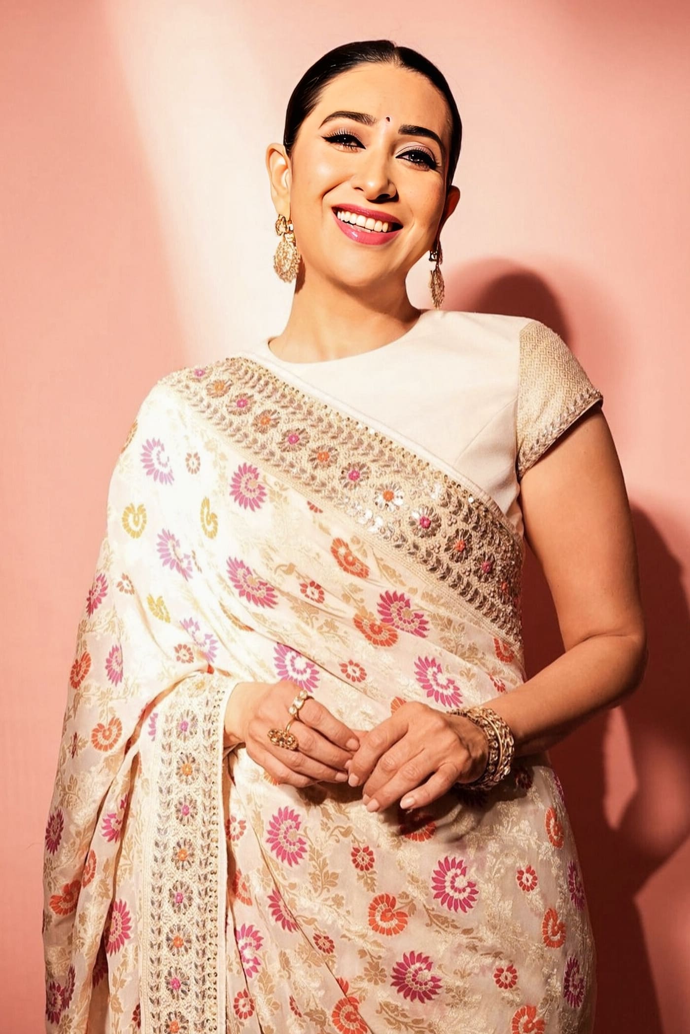 Karisma Kapoor inspired cream Banarasi silk saree with floral motifs gota patti pearl and sequin embroidery for wedding wear