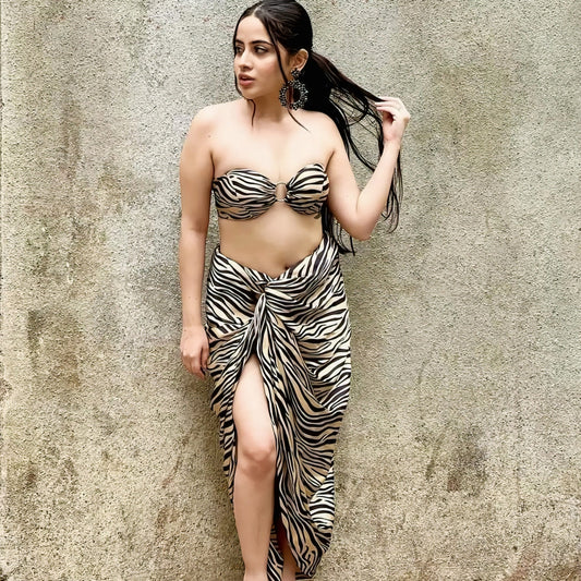 Urfi Javed wearing zebra print bandeau top with draped sarong skirt, bold resort wear fashion look