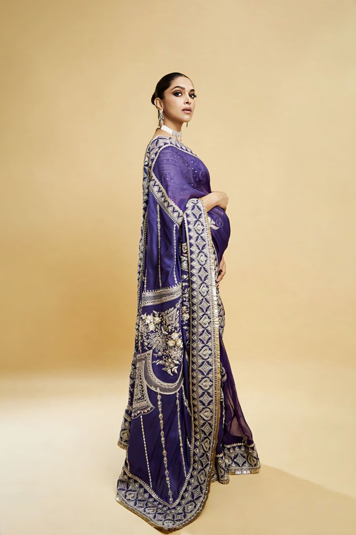Deepika Padukone inspired purple organza saree set with embroidered and embellished detailing and silk blouse for festive wear