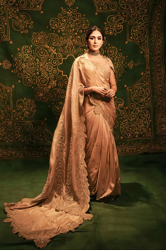 Mrunal Thakur wearing beige and golden Kasoori Dilruba saree with cape