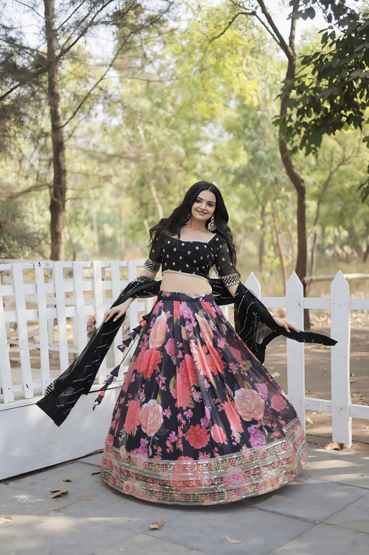 Woman wearing black blouse with floral pink lehenga and black dupatta for wedding, festive, Navratri, and party wear ethnic fashion.