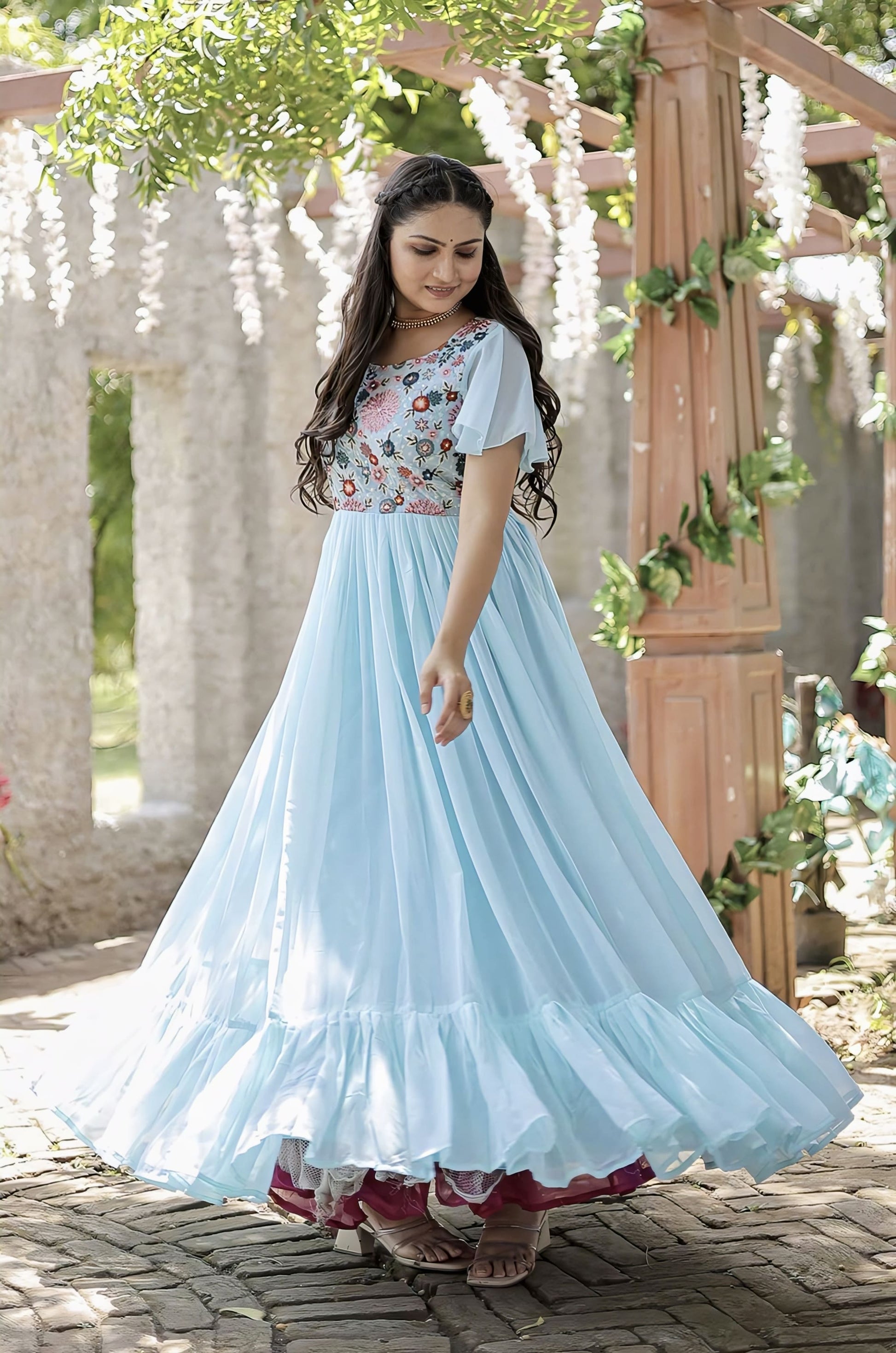 Sky blue faux georgette gown with floral embroidered bodice, sequins multithread work, square neckline, bell sleeves, and tiered ruffle hem for festive wear