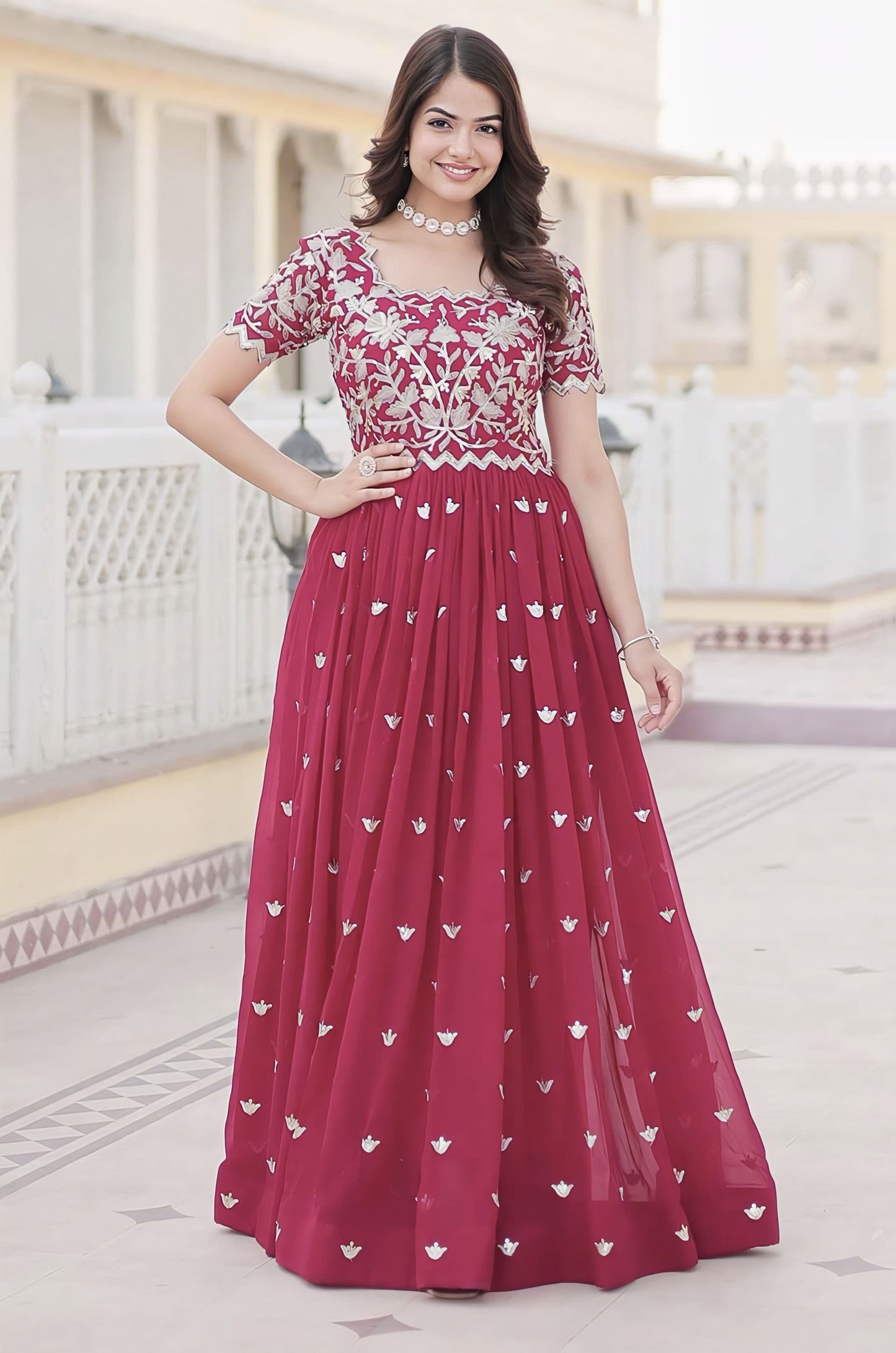 Hot pink georgette gown with coding sequins embroidery, silver motifs, short cut work sleeves, and cotton lining for festive and party wear