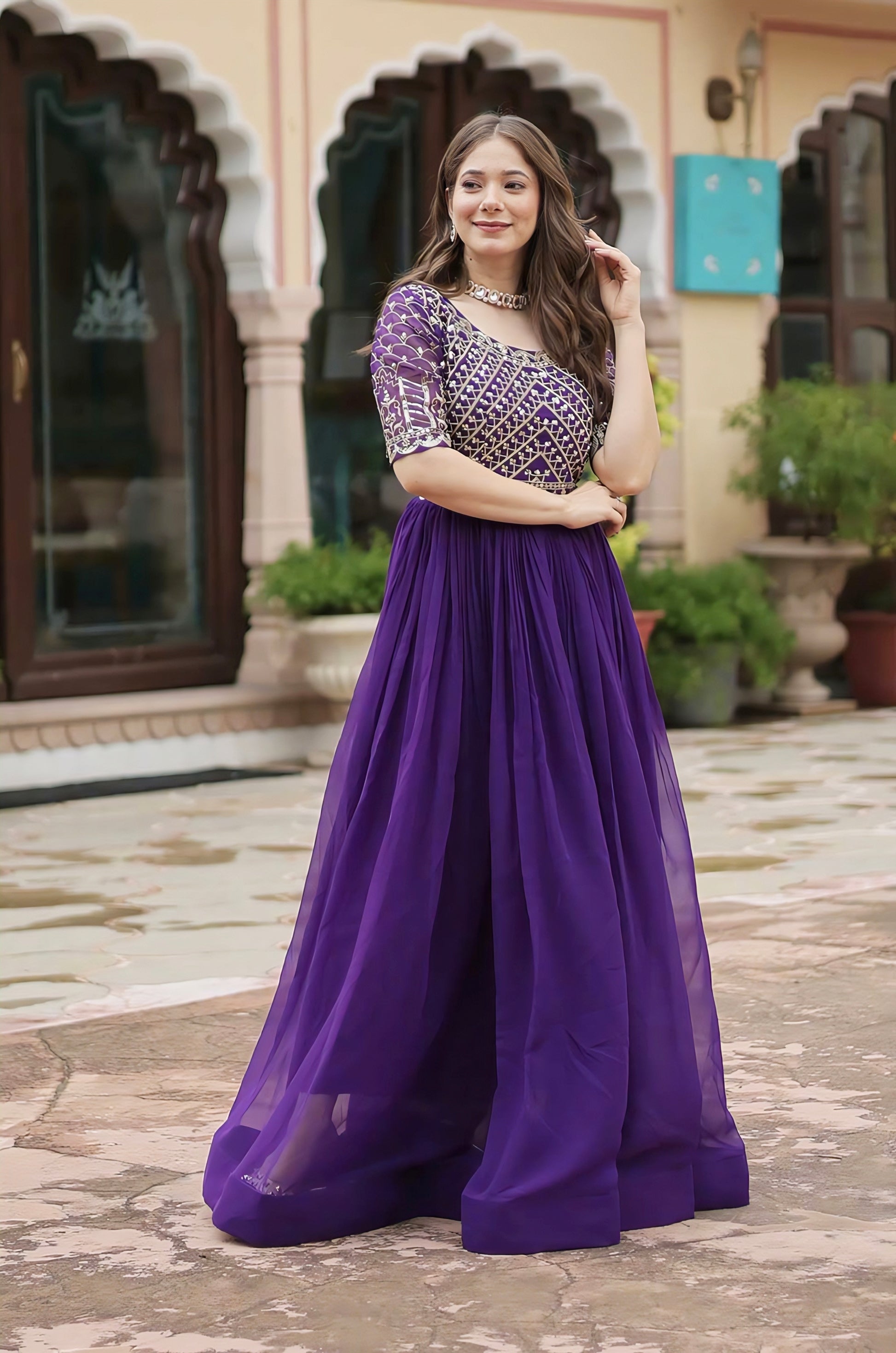 Purple faux blooming gown with zari sequins embroidery, fancy round neck, half sleeves, and cotton lining for festive and wedding wear