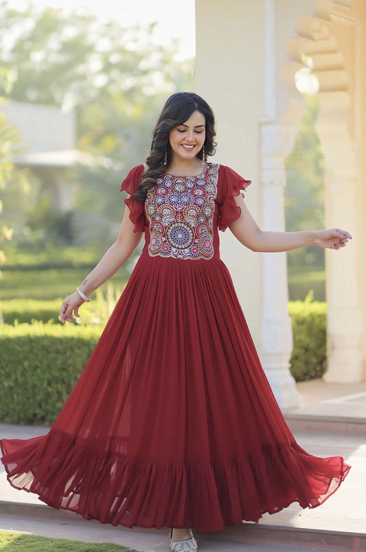 Maroon faux blooming frill gown with beads sequins embroidery, bell sleeves, round neck, and 7 meter flair for festive and wedding wear