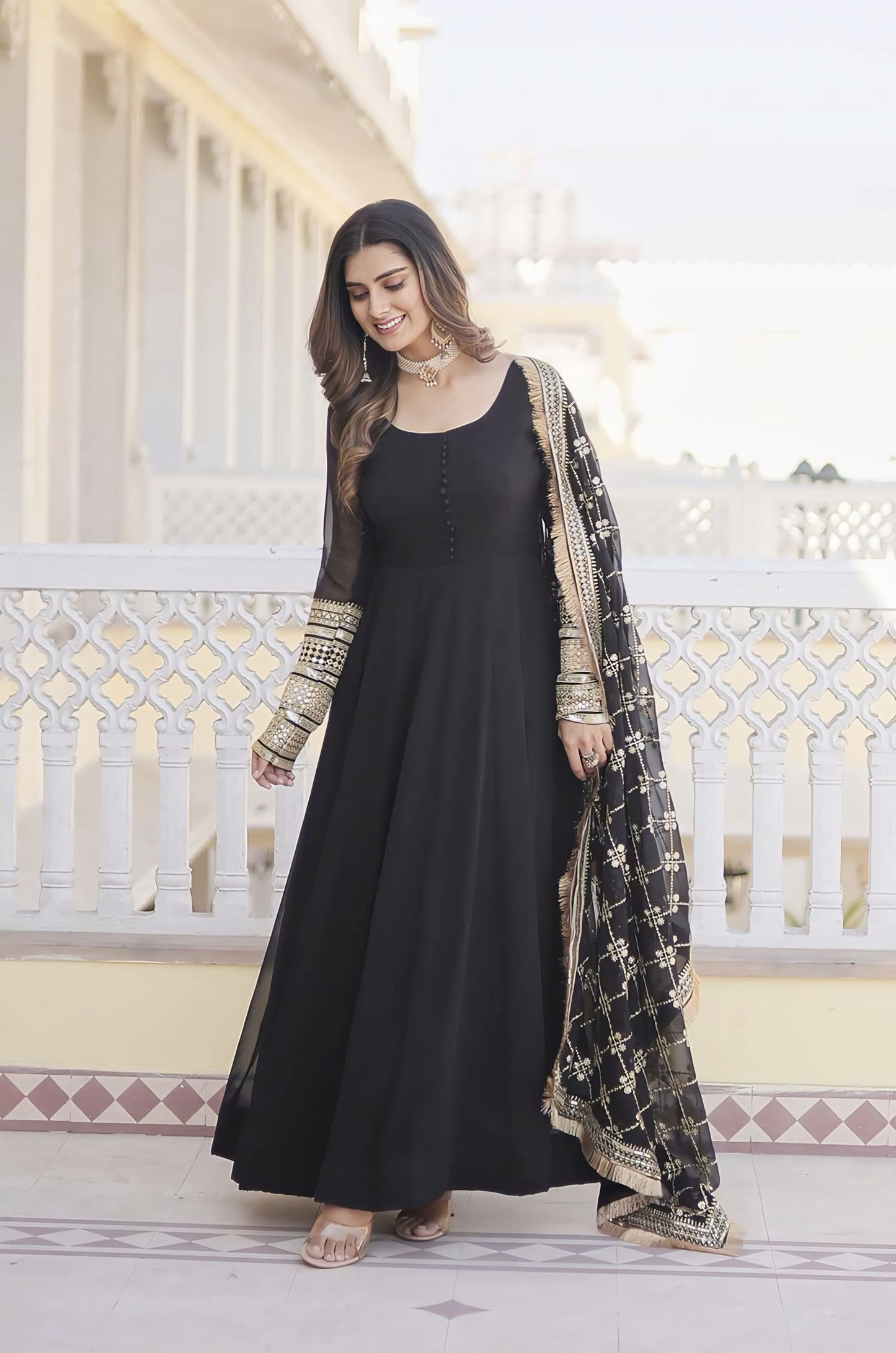 Black faux blooming designer gown with sequins embroidered work, round neck, cotton lining, and matching dupatta with lace border for festive and wedding wear