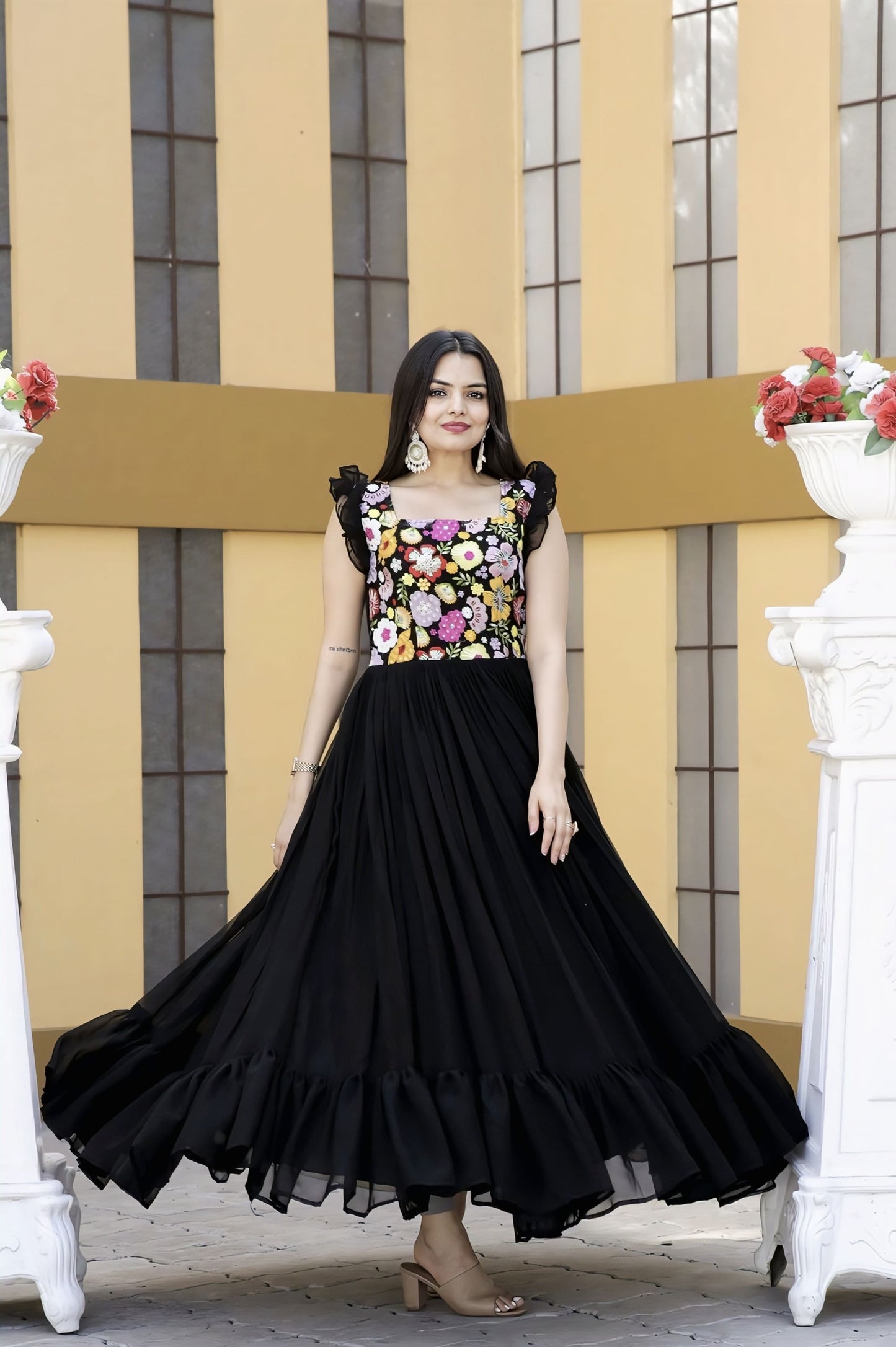 Black faux blooming gown with sequins multi-thread embroidery, square neck, sleeveless double frill shoulders, frill stitch detailing, and cotton lining for festive wear