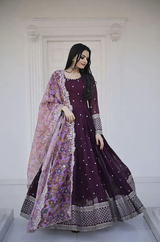 Wine faux blooming gown with zari sequins embroidery, full sleeves, round potli neck, cotton lining, and soft organza cutwork dupatta for festive and wedding wear