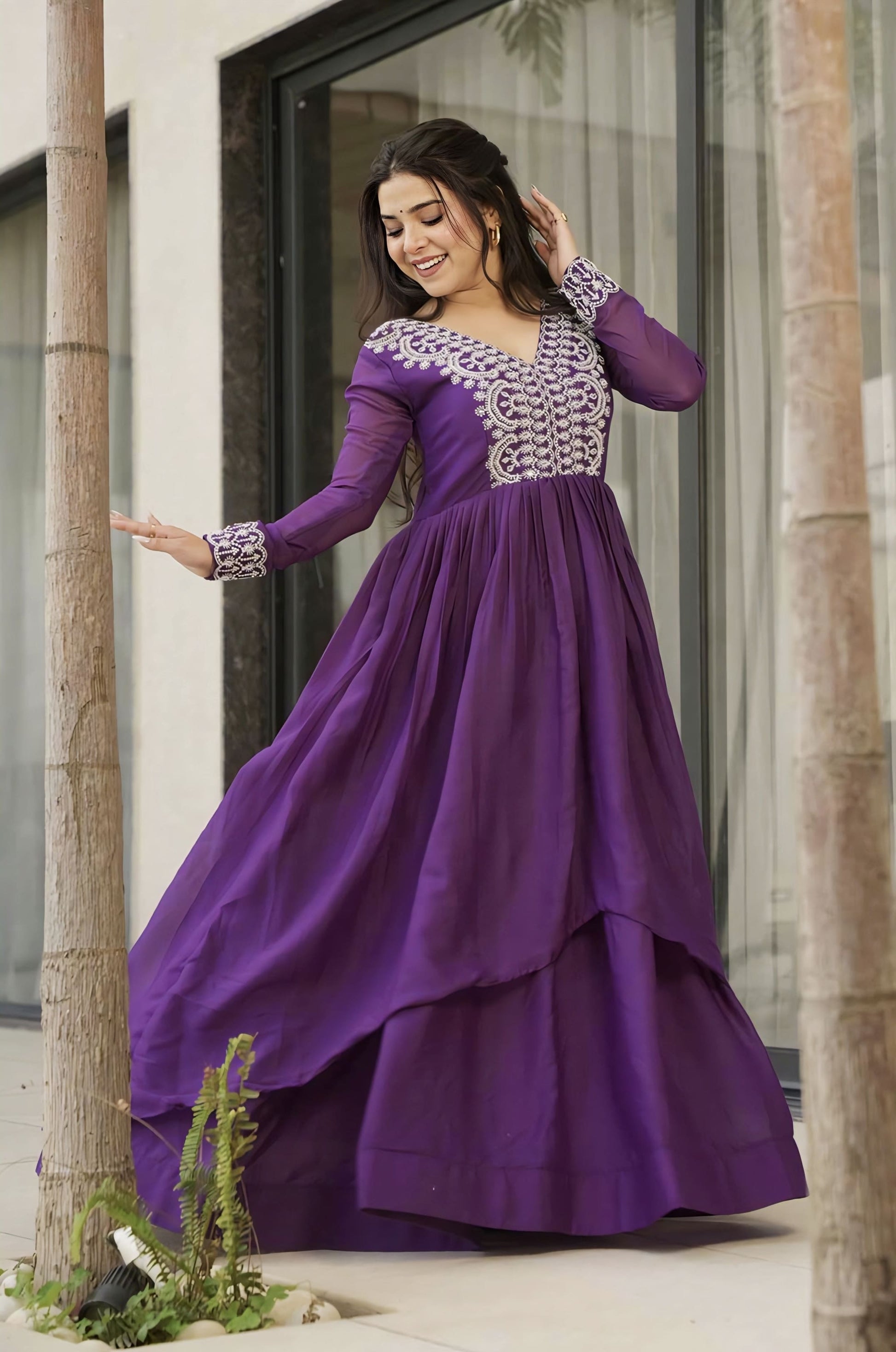 Purple star georgette gown with beads and sequins embroidery, V-neckline, full sleeves, double flair stitching, and cotton lining for festive and wedding wear