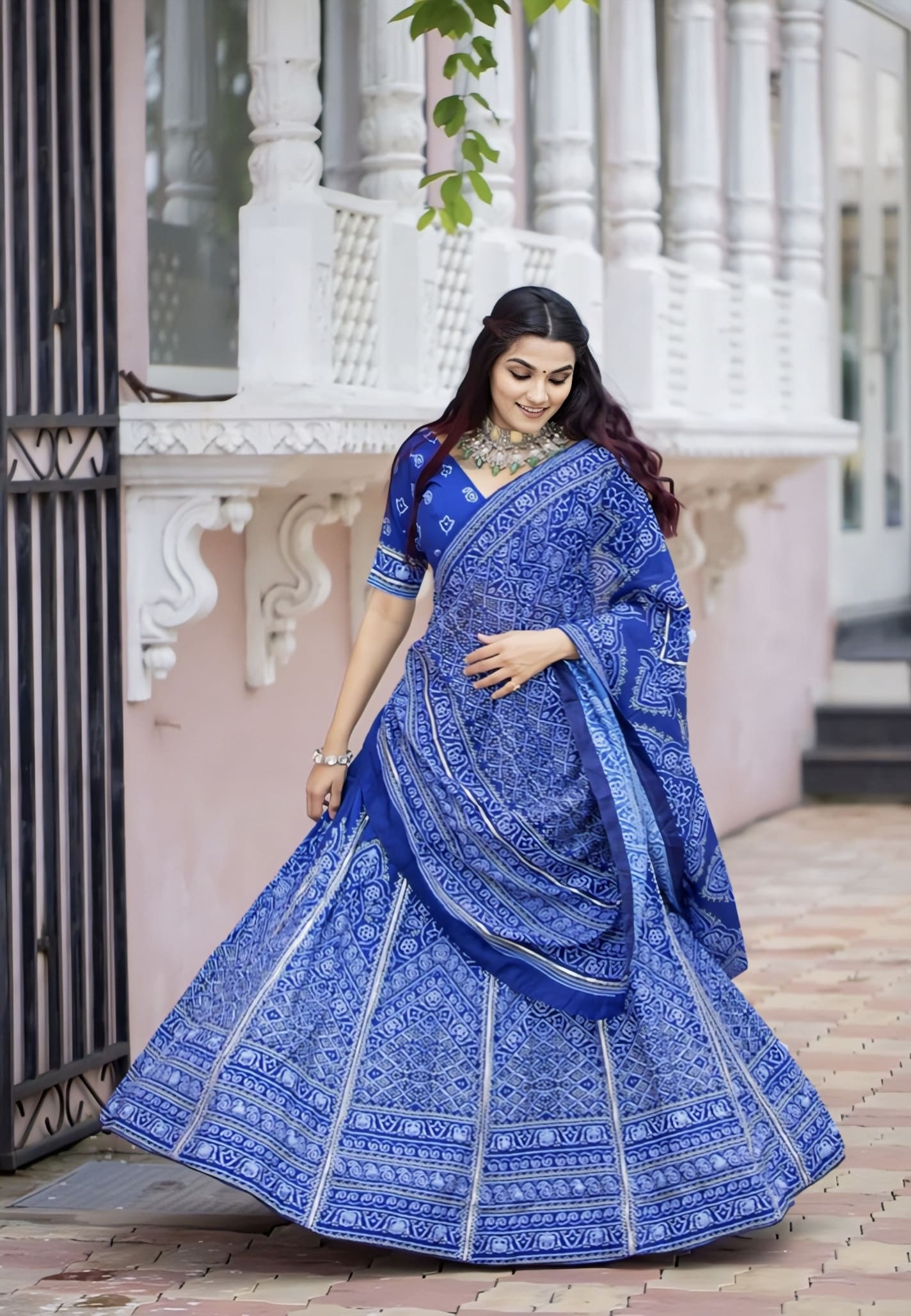 Indigo blue Bandhani printed silk lehenga choli set with gota patti work, tassels, and muslin silk dupatta for Navratri and festive wear