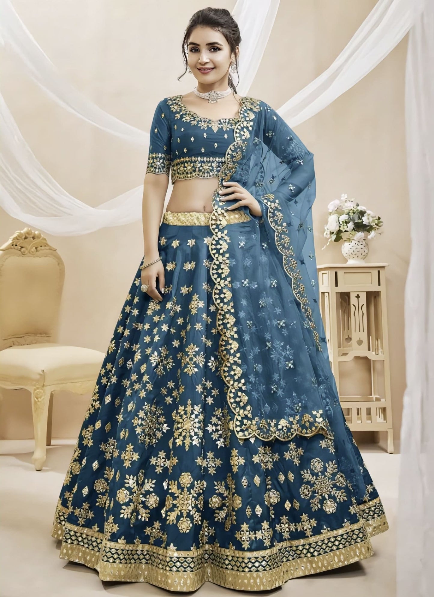 Teal blue mulberry silk lehenga choli with foil mirror work, zari embroidery, matching blouse, and net dupatta for wedding and festive wear