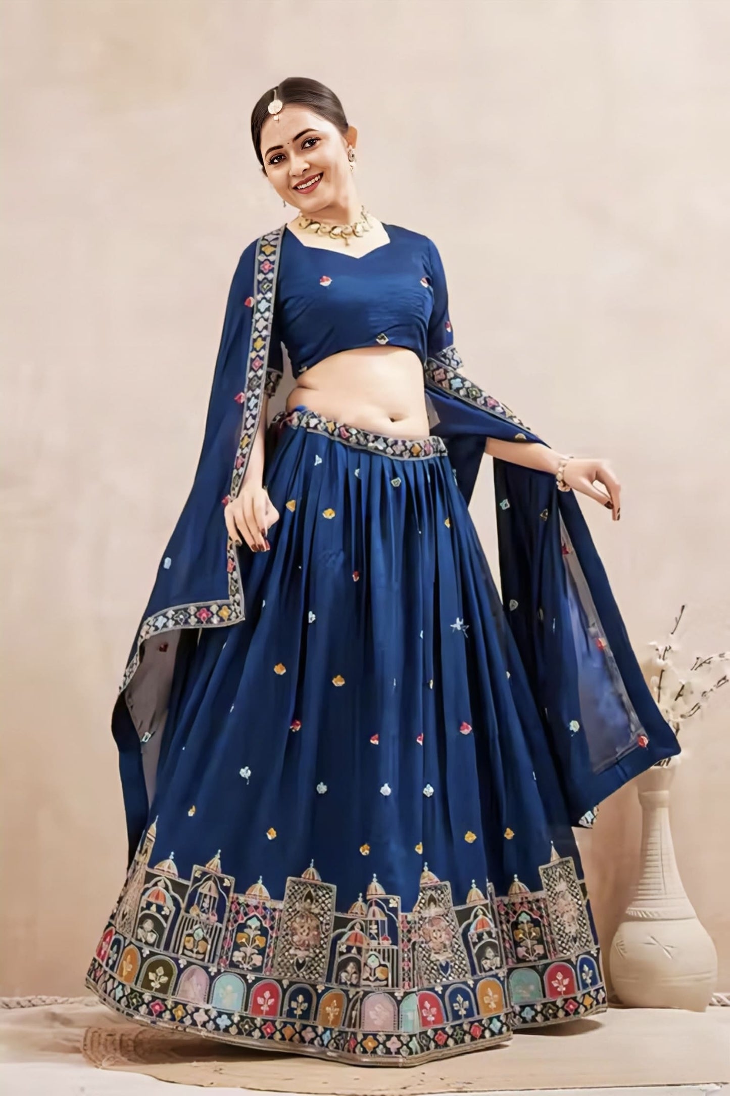 Navy blue Vichitra silk lehenga choli with multi-color temple embroidery, short sleeve choli, and matching dupatta for wedding and festive wear