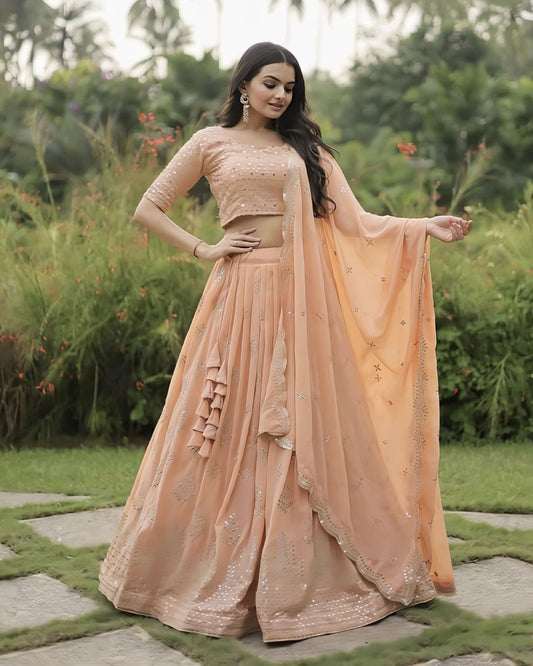 Peach faux georgette lehenga choli with heavy sequins zari embroidery, designer blouse, and matching dupatta for wedding and festive wear