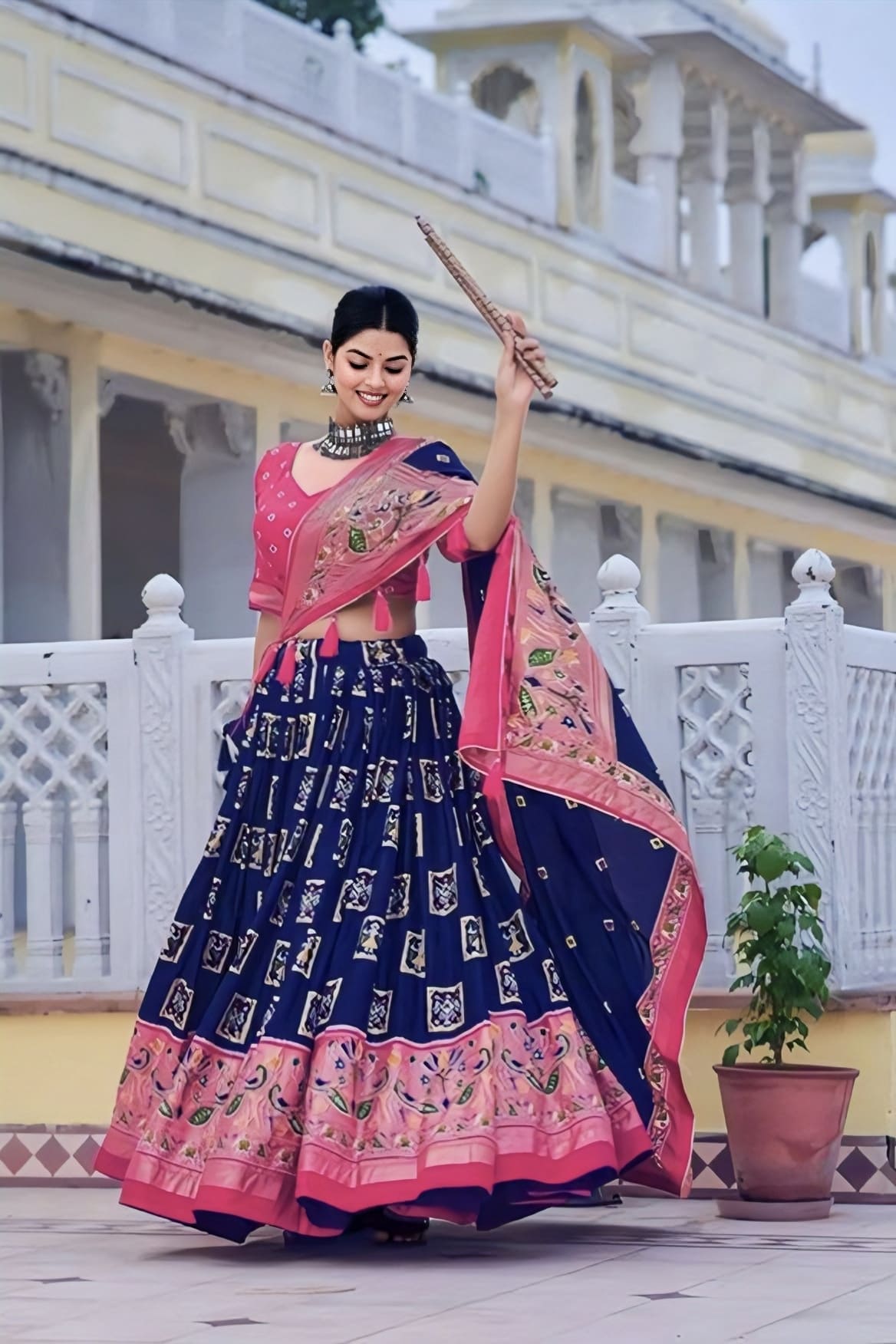 Blue tussar silk lehenga choli with pink Bandhani peacock foil print blouse and geometric traditional design for festive and wedding wear
