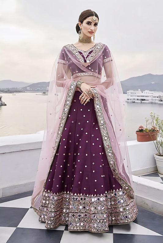 Wine silk lehenga with heavy mirror embroidery, sequence work, Zarkan detailing, and pink dupatta for wedding and festive wear