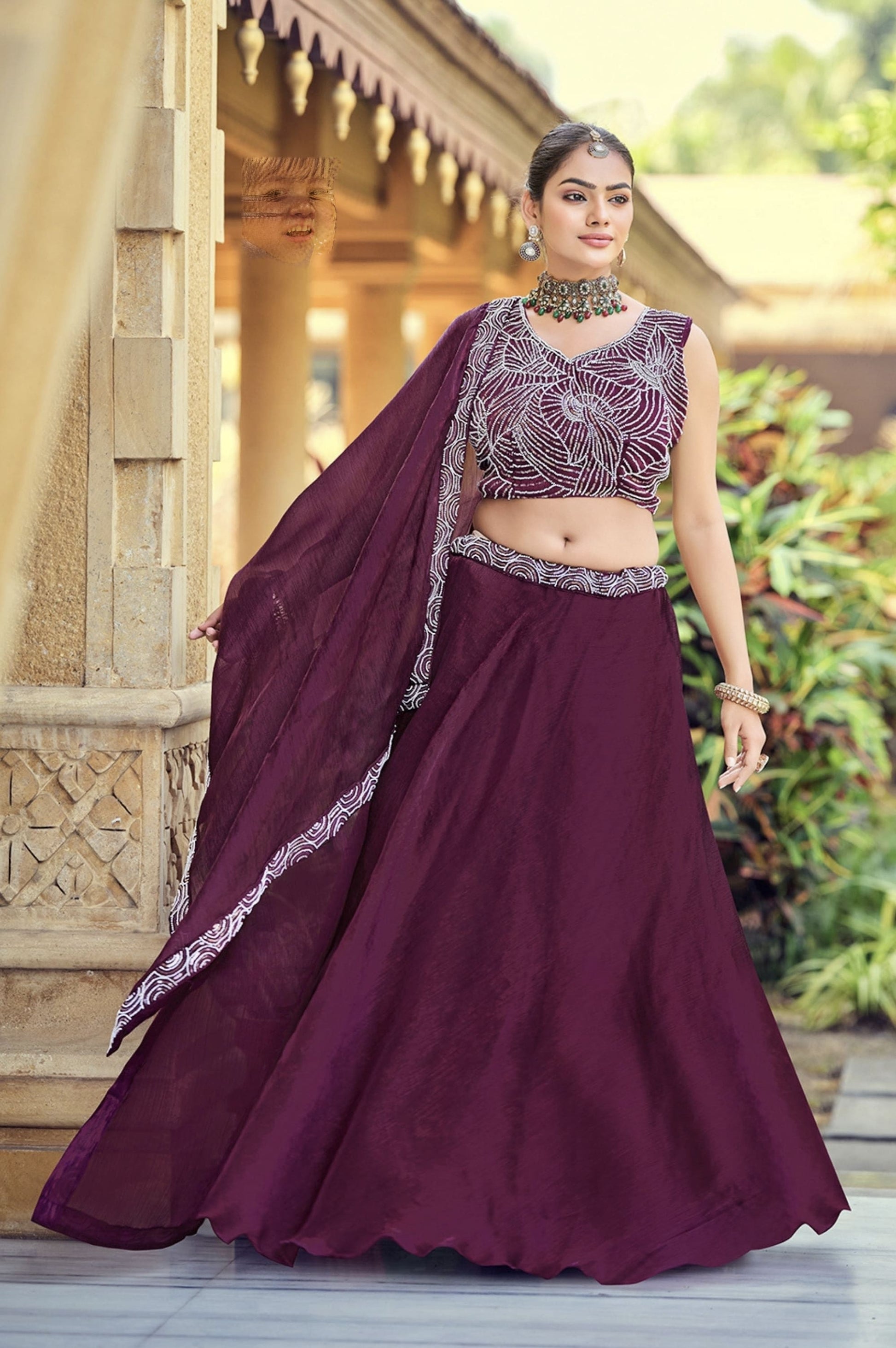 Wine embroidered silk lehenga choli with sequins work and matching dupatta for wedding and festive wear