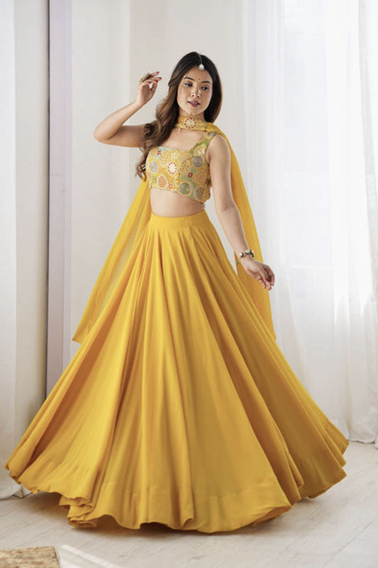 Yellow fully flared fox georgette lehenga choli with intricate embroidery work for Haldi, wedding, and festive wear