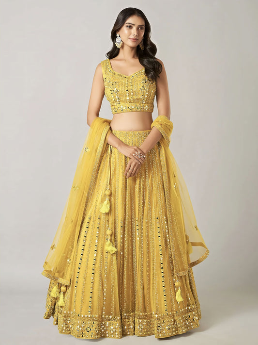 Yellow net lehenga choli with stone, resham, Aabla, and mirror work featuring sleeveless sweetheart neck design for wedding and party wear