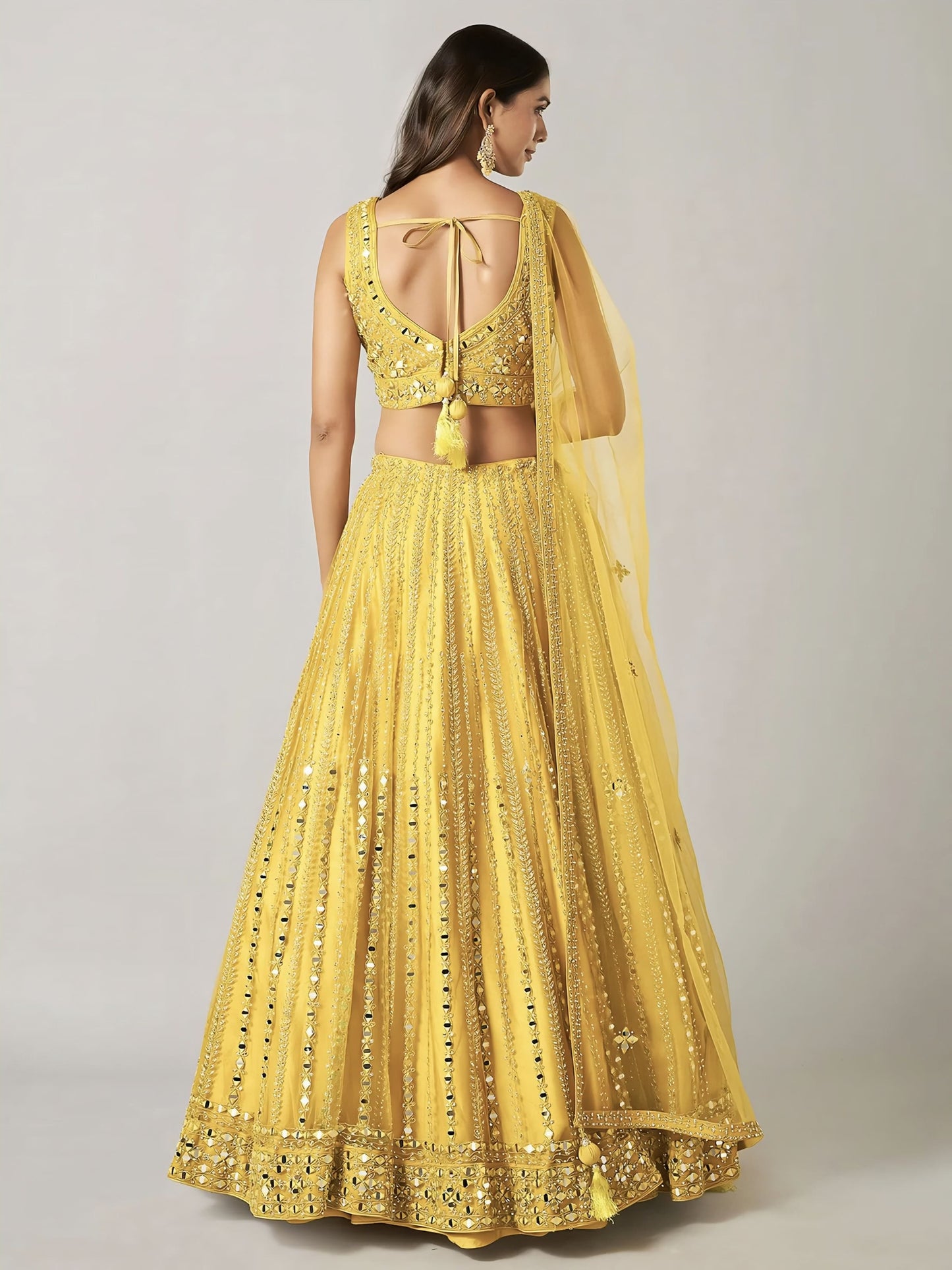 Yellow Net Lehenga Choli with Stone, Resham & Mirror Work for Party Wear