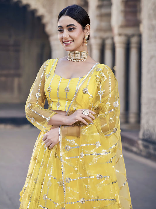 Classic Yellow Soft Net Lehenga Choli with Sequence Embroidery for Party Wear