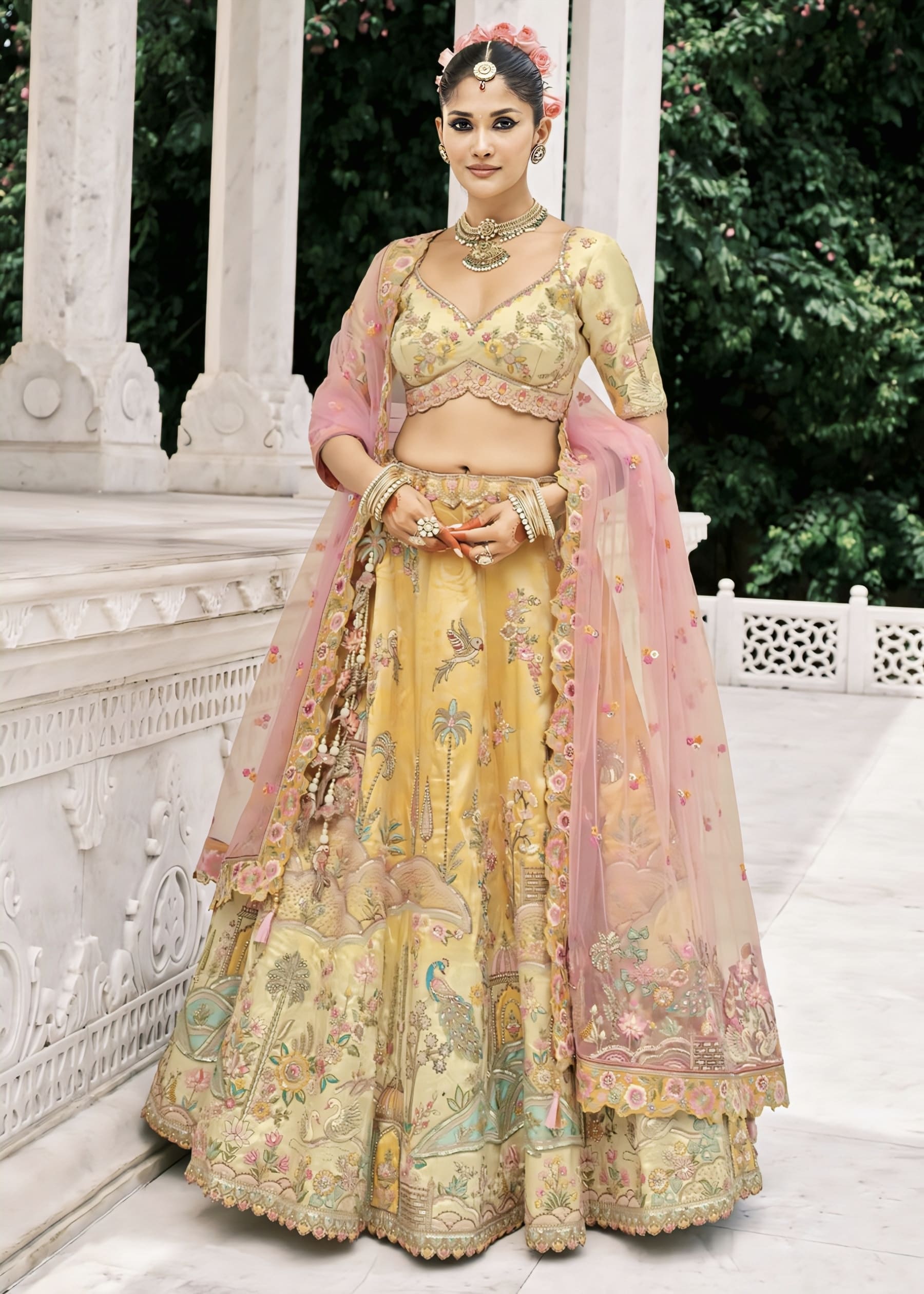 Yellow embroidered silk lehenga choli with multi-thread embroidery, stone, sequins, zari work, and contrast pink dupatta for wedding and festive wear