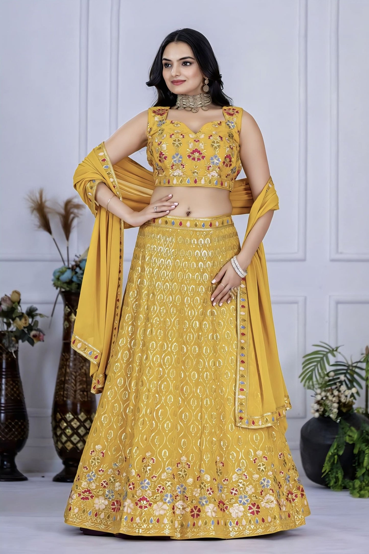 Yellow ready to wear fox georgette lehenga choli with heavy multi-thread and sequence embroidery work, matching blouse, and embroidered dupatta for wedding and festive wear