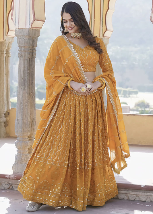 Mustard yellow georgette lehenga choli with embroidery, sequins work, matching blouse, and embellished dupatta for wedding and festive wear