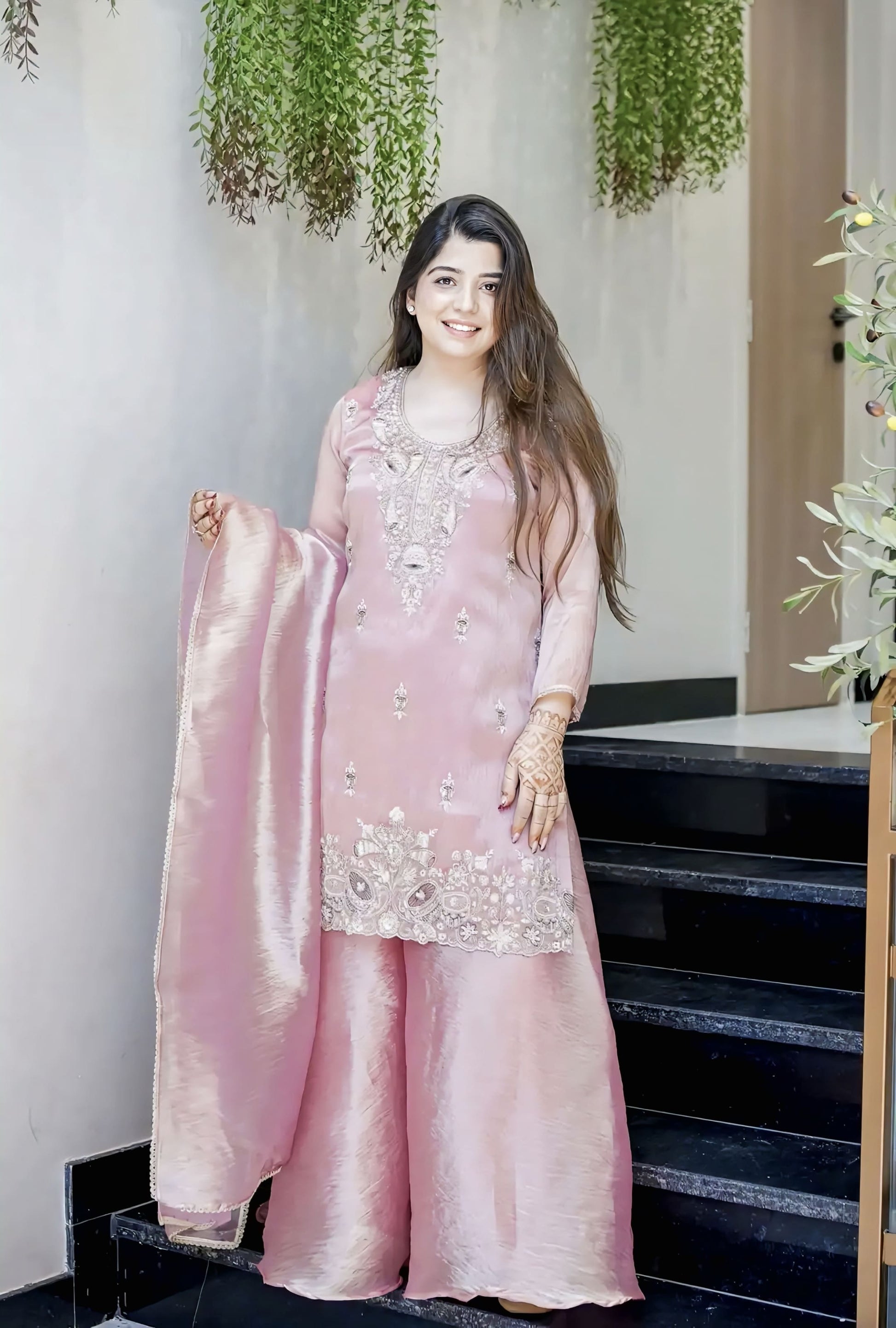 Pink Jimmy Choo silk salwar suit with embroidery sequence work and lace detailing for wedding and festive wear
