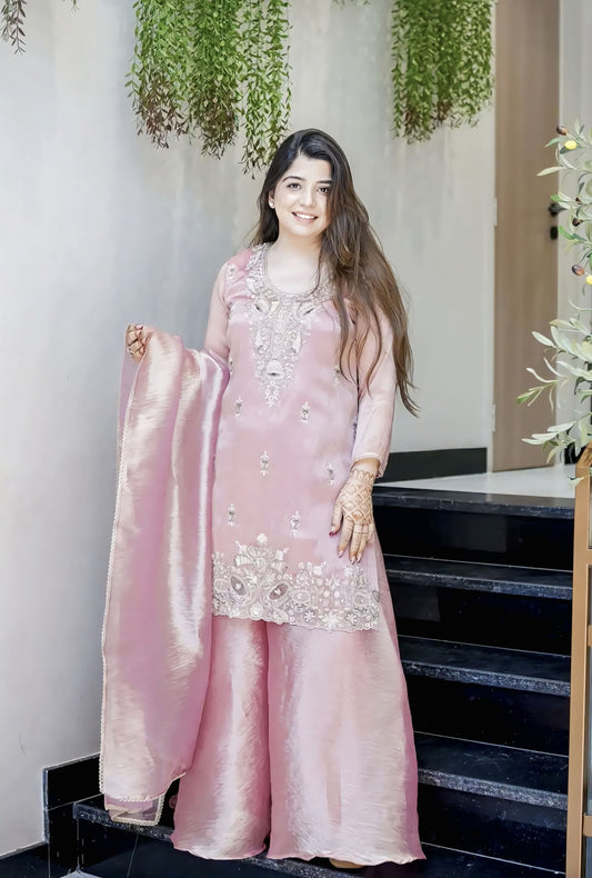 Pink Jimmy Choo silk salwar suit with embroidery sequence work and lace detailing for wedding and festive wear